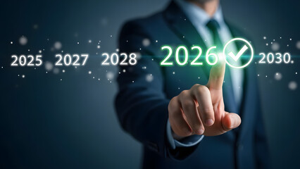 Business professional selecting the year 2026 on a futuristic digital display