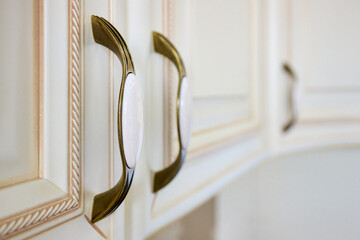 Zinc Alloy Antique Bronze Ceramic White Cabinet Handles selective focus close up shot. Country House Porcelain Handles.
