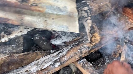 Hot Stones and Burning Wood Fire for Traditional Papuan Bakar Batu