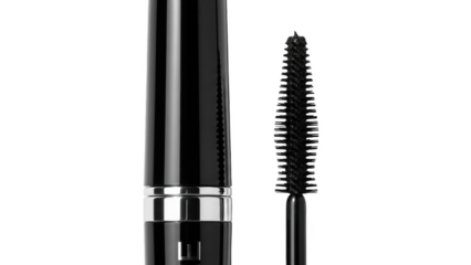 Black mascara tube and wand on black background cosmetic