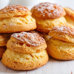 Fototapeta premium Freshly Baked Golden Scones with Sugar Dusting on Wooden Surface