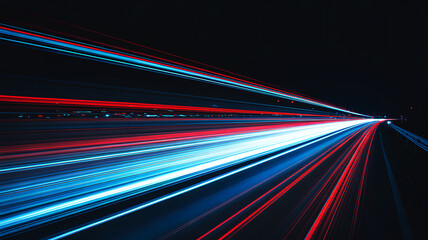 Red and blue light trails on dark highway at night