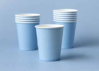 Disposable light blue paper cups closeup, mockup, copy space. No plastic biodegradable single-use