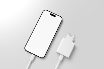 Realistic smartphone mockup. Modern phone with blank screen with charger, placed on a gray table.