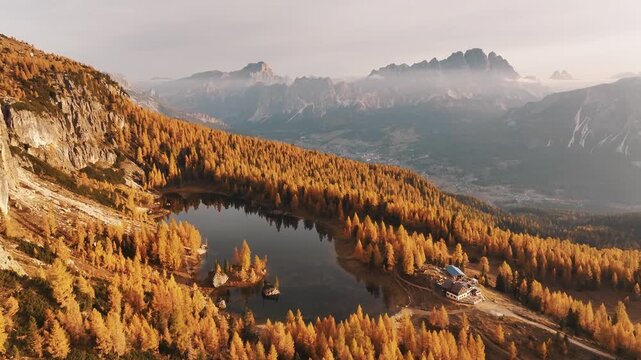Crystal clear water. Lake Federa near the Croda da Lago mountain at autumn time, majestic landscape, raw nature.