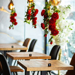 A beautifully designed restaurant interior showcasing a modern and elegant dining area. The space features contemporary furniture, including wooden chairs and tables set with glassware, plates.