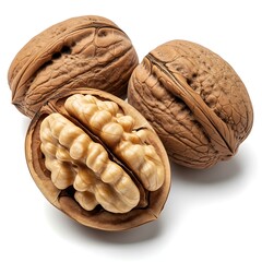 A focus on the cracked open walnut, revealing the nutritious, edible seed, with two whole nuts in soft focus