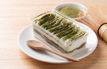 Matcha Tiramisu cake with green tea powder on top, Italian dessert fusion with Japanese