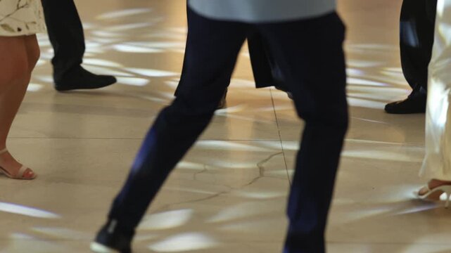 Detailed depiction of movement and footwear on gleaming wood surface