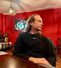 portrait of a young man in a cafe