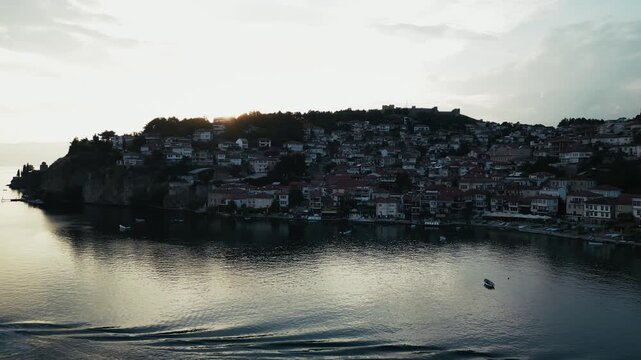 Gorgeous aerial footage of the Ohrid city on the lakeshore, ferry sailing, 4k