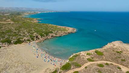 Aerial view of Cala Mosche (or Calamosche) beach, a beautiful sandy beach within the Vendicari Nature Reserve, in province of Syracuse, Sicily, Italy. It's famous for its crystal clear and blue sea.