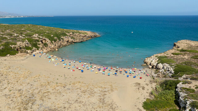 Aerial view of Cala Mosche (or Calamosche) beach, a beautiful sandy beach within the Vendicari Nature Reserve, in province of Syracuse, Sicily, Italy. It's famous for its crystal clear and blue sea.