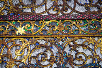 Ornate Decorative Metalwork with Colorful Inlays and Intricate Design