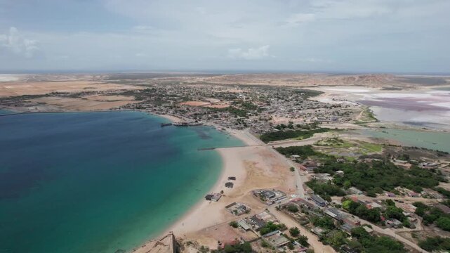 Drone view of Araya's stunning bay and town, capturing vibrant coastal life