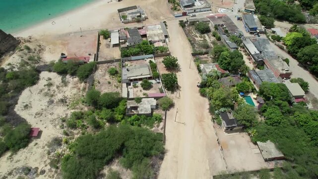 Aerial view of Araya beach, showcasing sandy shore and nearby buildings