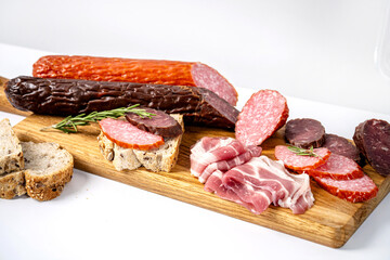 Mixed cured meats on rustic board
