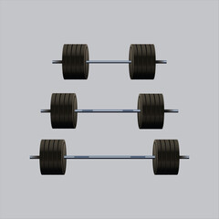 Weights on gray background: A display of weightlifting equipment, precisely arranged against a neutral gray background. Each weight is a symbol of strength and progress.