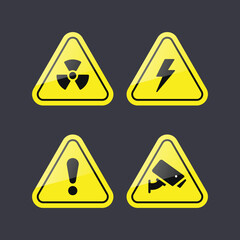 Set of Four Yellow Warning Symbols for Radiation Electrical and General Hazards
