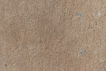 Rough earthy brown concrete wall texture. Natural plaster background for architectural design and construction