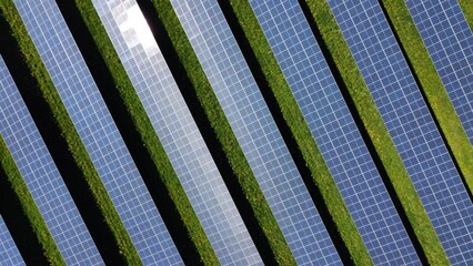 Solar panel field from above drone view. Green energy generation sun power in nature farmland.