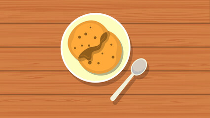 Golden brown pancakes drizzled with rich chocolate sauce, served on a white plate with a spoon, offering a delightful and comforting meal on a warm wooden surface