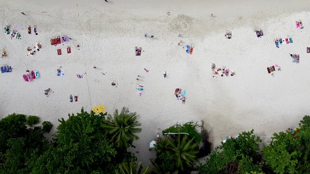 Aerial view of boats and swimmers in a beautiful Thailand island