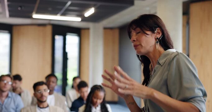 Woman, pointing and presentation with speech at seminar for training, press conference or media coverage. Presenter, briefing and audience listen in journalism workshop, public relations and upskill