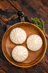 Dumpling Momos with pork meat in wooden plate. wooden background. top view