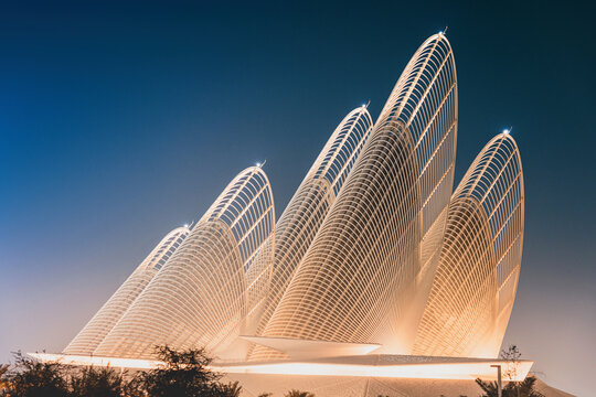 6 December 2025, Abu Dhabi, UAE: Zayed National Museum building illuminated at night against a deep blue sky, presenting contemporary architecture