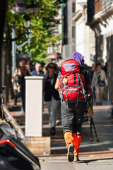 Camino de Santiago pilgrims in street of Bilbao city walking the Camino del Norte to Compostela , spanish route , Europe