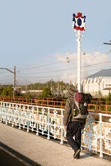 Pilgrims on International Bridge  Avenue on the Bidasoa river  that connects Hendaye with Irun on  Camino del Norte to Santiago de Compostela, Way St. James