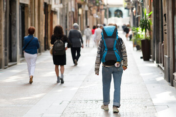 Camino de Santiago pilgrims in street of Bilbao city walking the Camino del Norte to Compostela , spanish route , Europe