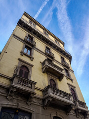 Old residential building along Via Guerrazzi in Milan, Italy