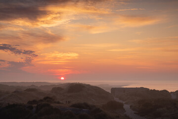 sunrise ove the baltic sea at foggy morning