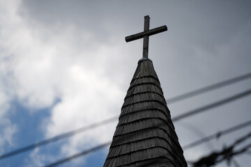 the roof of an old church built of shingles.