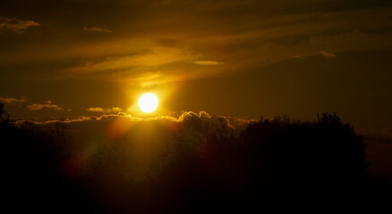 sunset seen through the clouds.
