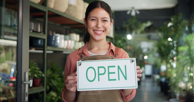 Happy, open sign and face of woman in store for sustainability, plants or greenery at small business. Board, smile and portrait of female botanist with pride for announcement at eco friendly nursery.