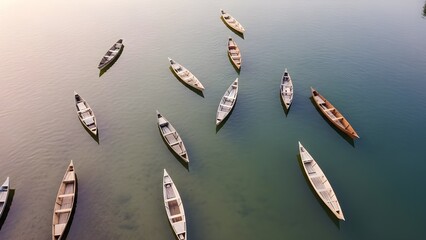Aerial view of traditional wooden boats floating on calm water