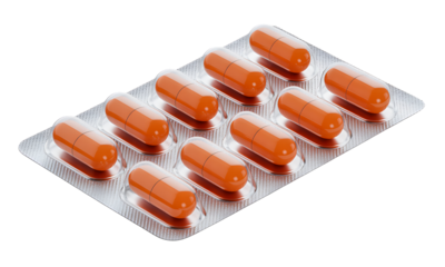 Close-up studio shot of orange capsules in a silver blister pack, illustrating health and wellness support.