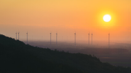 sunset over the austrian wind mills