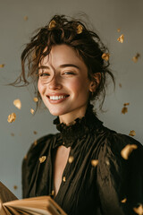 Joyful young woman laughing with golden petals floating around her
