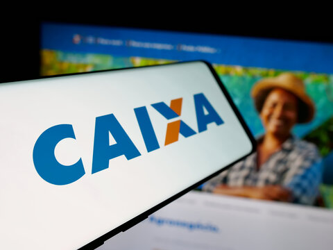 Stuttgart, Germany - 12-02-2025: Smartphone with logo of Brazilian Caixa Economica Federal (CEF) on screen in front of website. Focus on left of phone display.
