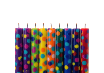 seven vibrant confetti-spotted birthday candles burning with steady golden flames, aligned horizontally on a stark white infinity cove with ample copy space. concept of festive celebration