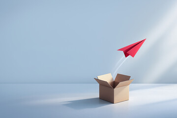 Red paper airplane flying out of open cardboard box symbolizing creativity self learning development and innovation in minimalist studio with soft light