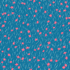Fototapeta premium Red flowers. Tiny spring blossoms on blue background with grass