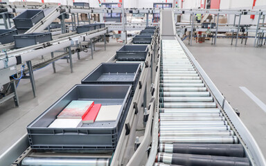 packing line in a logistics warehouse. conveyor belt in a modern production line
