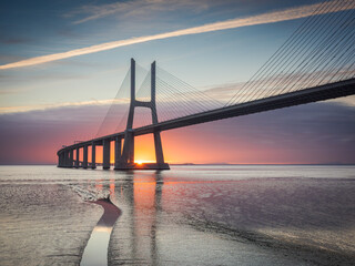 Vasco da Gama bridge over tagus river in Lisbon, Portugal, at sunrise