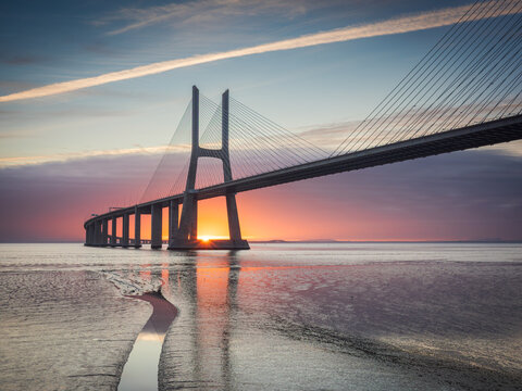 Vasco da Gama bridge over tagus river in Lisbon, Portugal, at sunrise