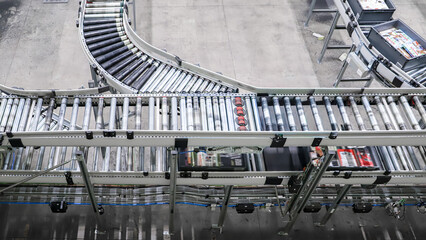packing line in a logistics warehouse. conveyor belt in a modern production line